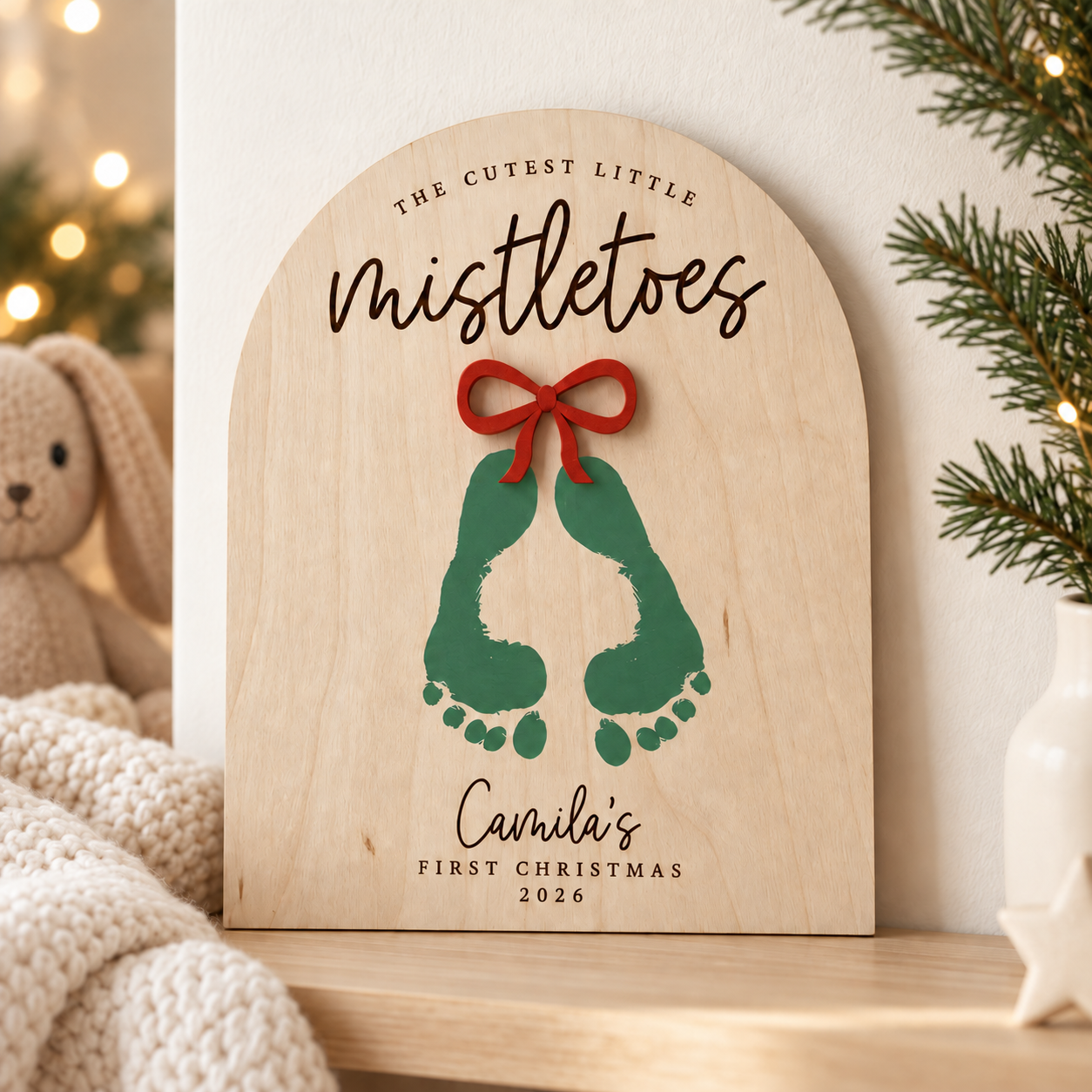 Personalised first Christmas keepsake with green footprints and red bow